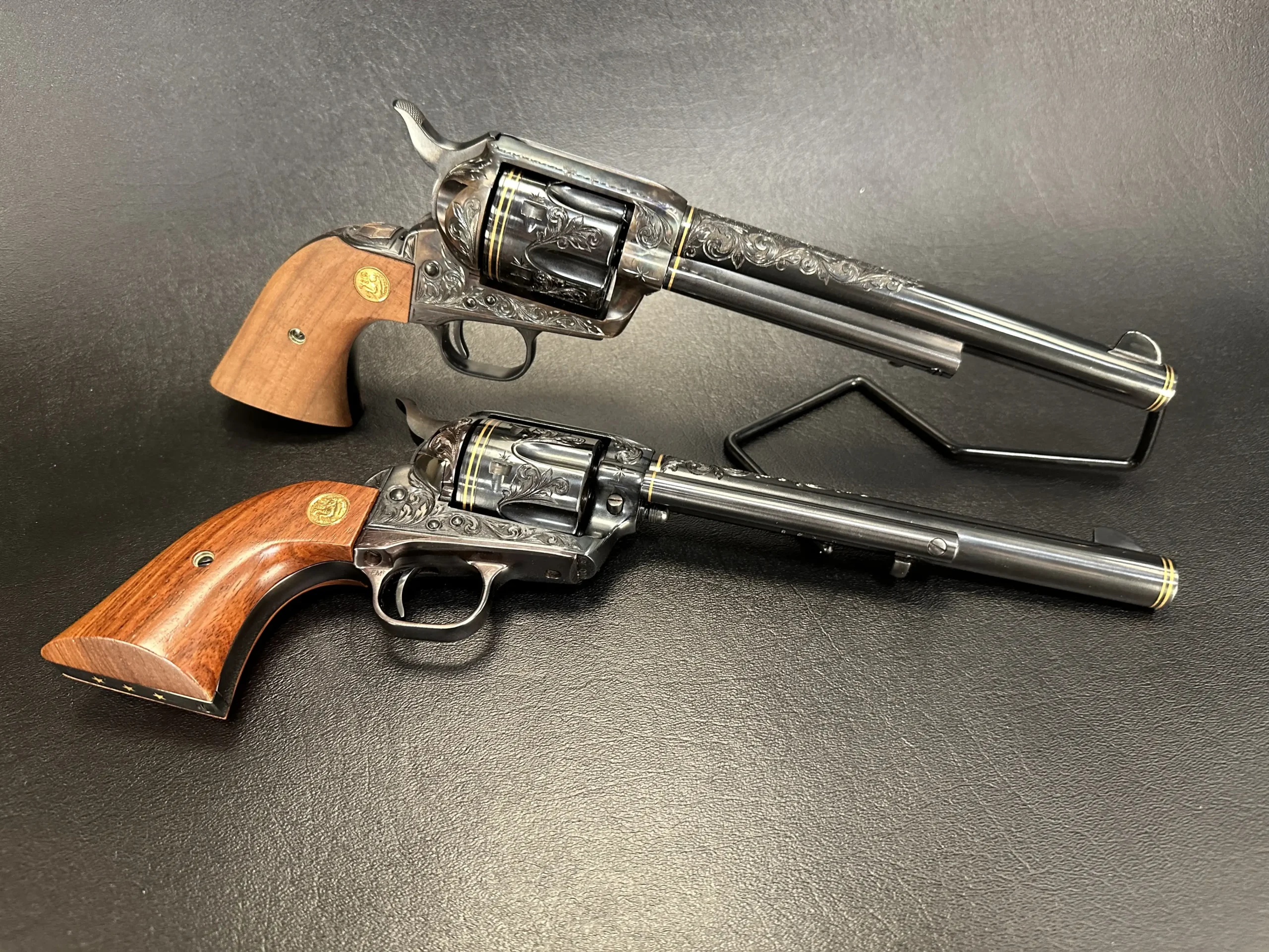 Colt SAA engraved revolvers matching pair collectible