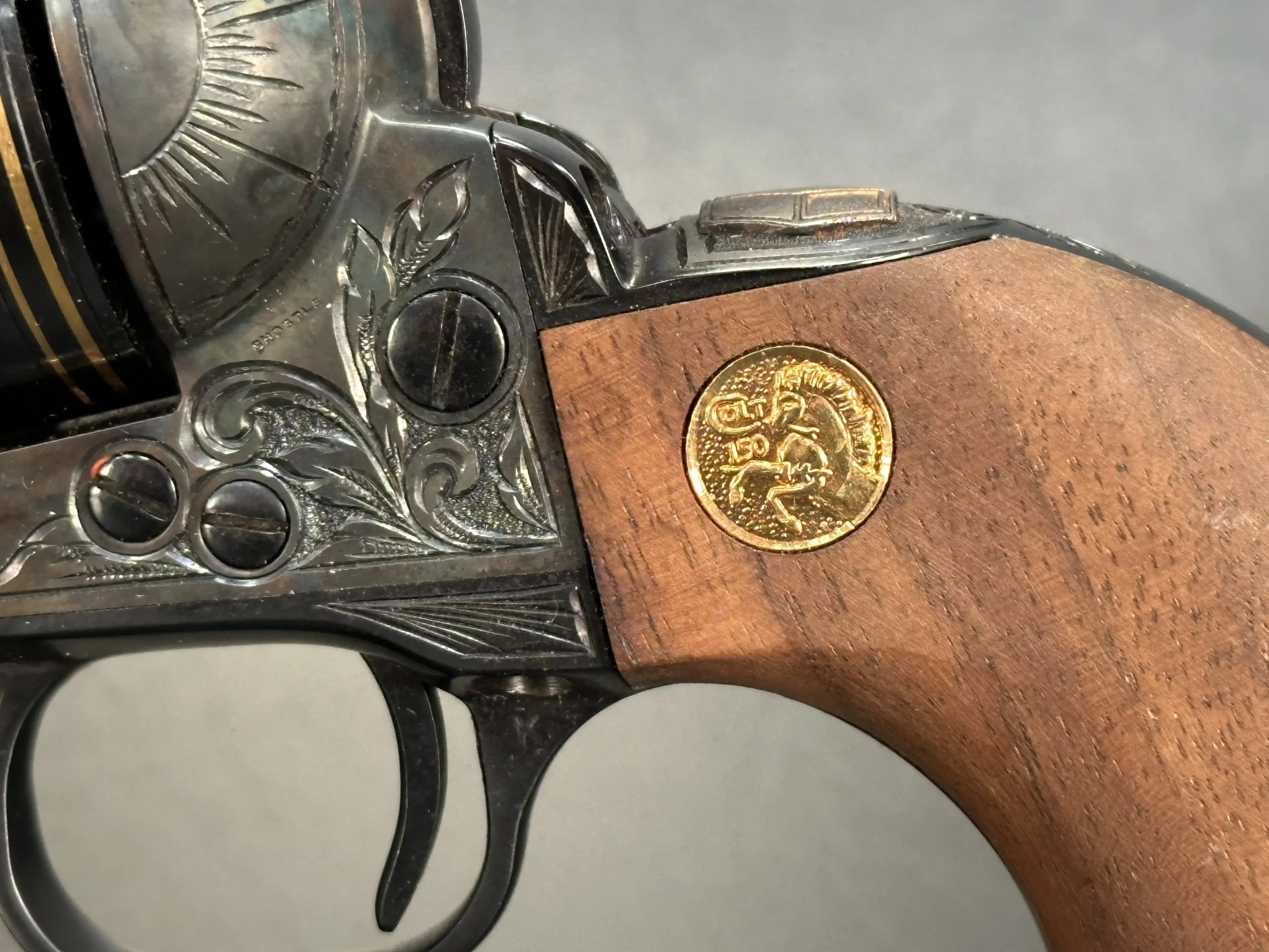 Factory engraved Colt SAA revolvers walnut grips