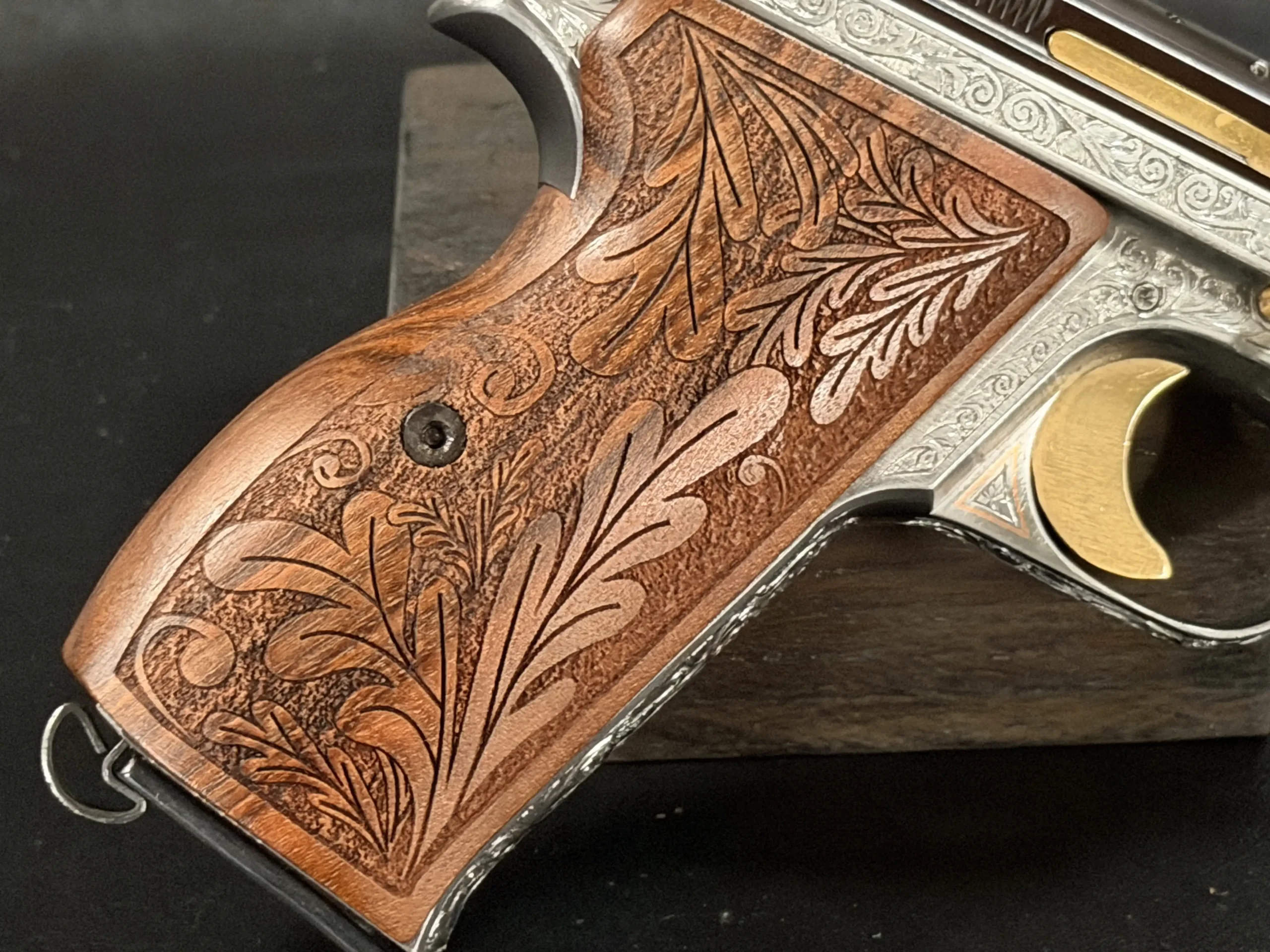 SIG P210 engraved pistol walnut grip carving detail