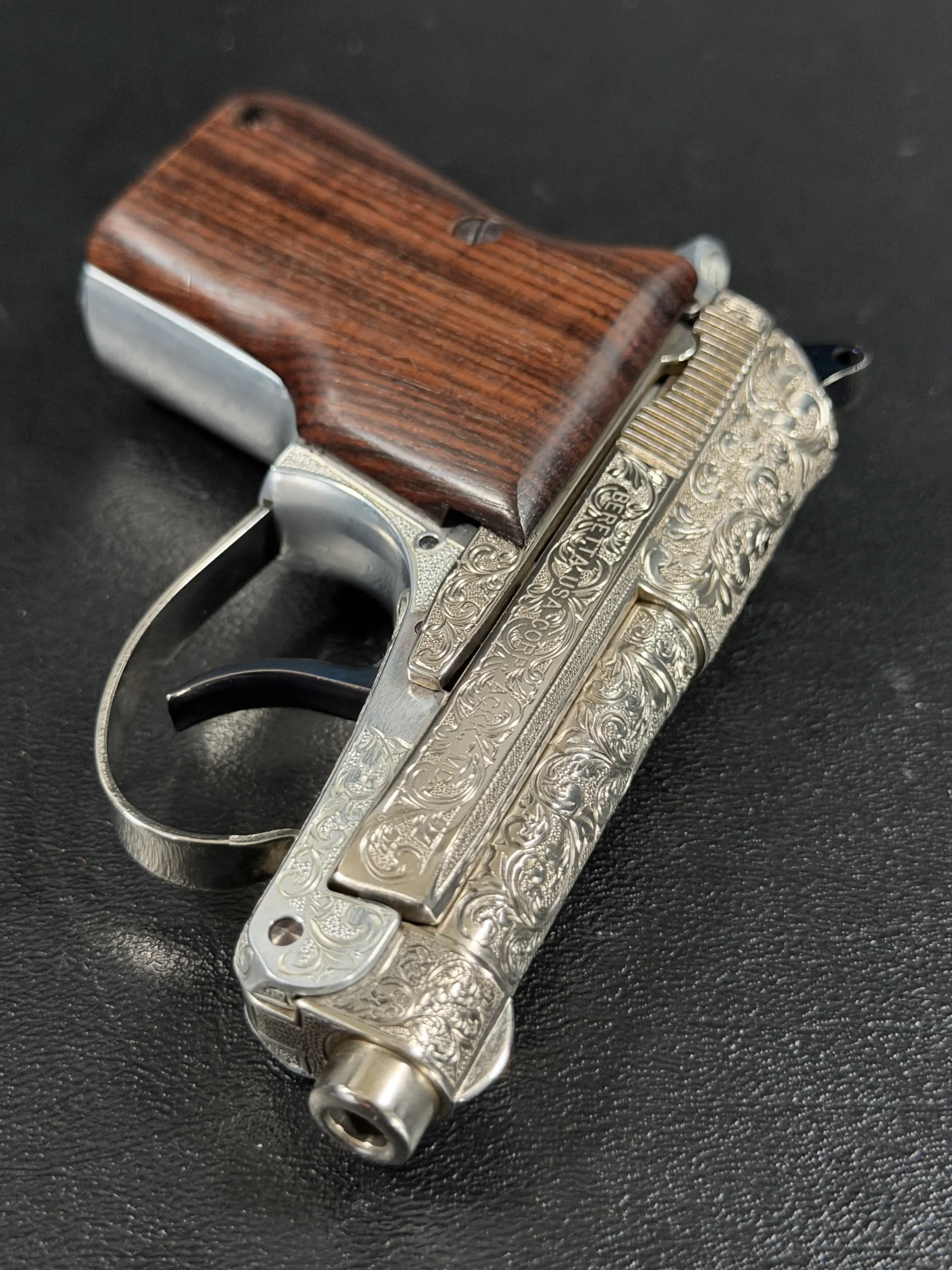 Engraved Beretta 21A scrollwork detail